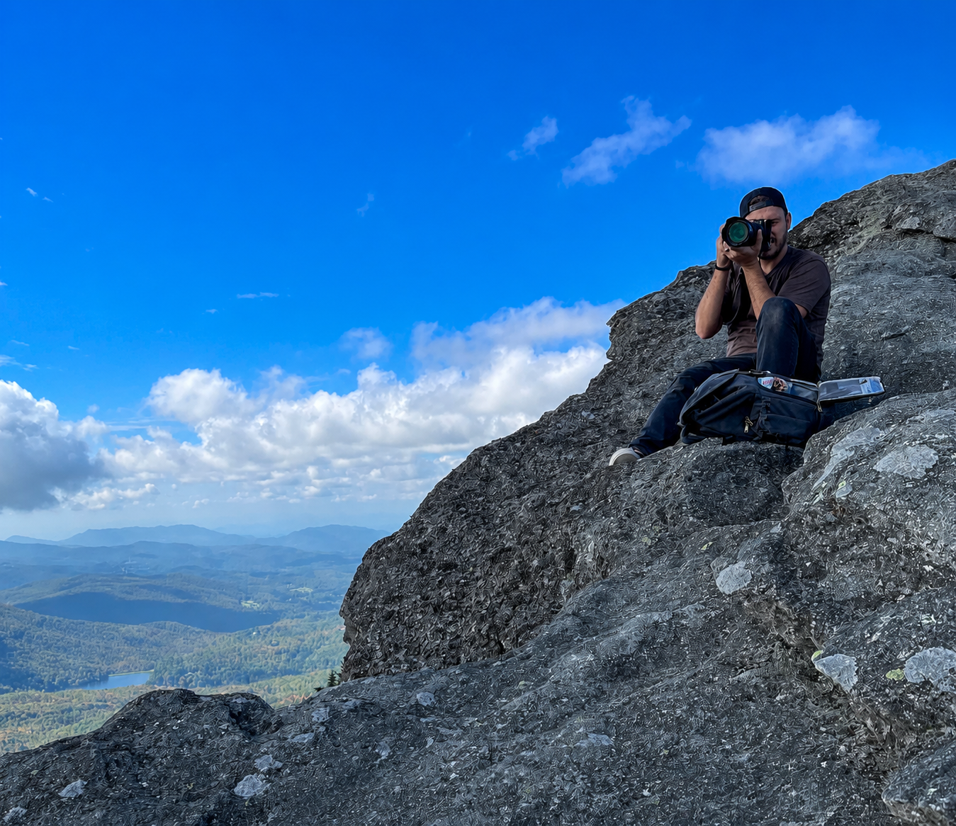 John Cieslik Jr. photographing a mountain landscape